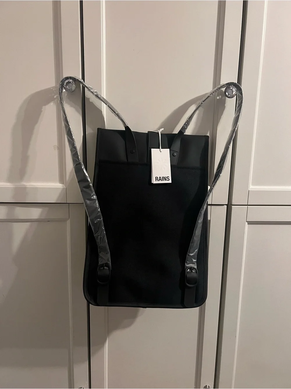 Rains Black Backpack with Front Buckle
